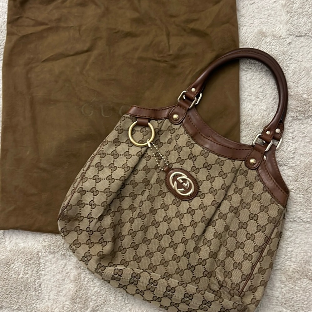 Gucci Sukey tote with brown leather trim
Length: 13.5" 
Height: 9.5"
Drop: 6"